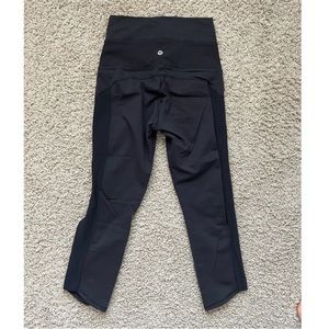 Lululemon Black crop leggings 20” inseam with full leg cutouts size 4